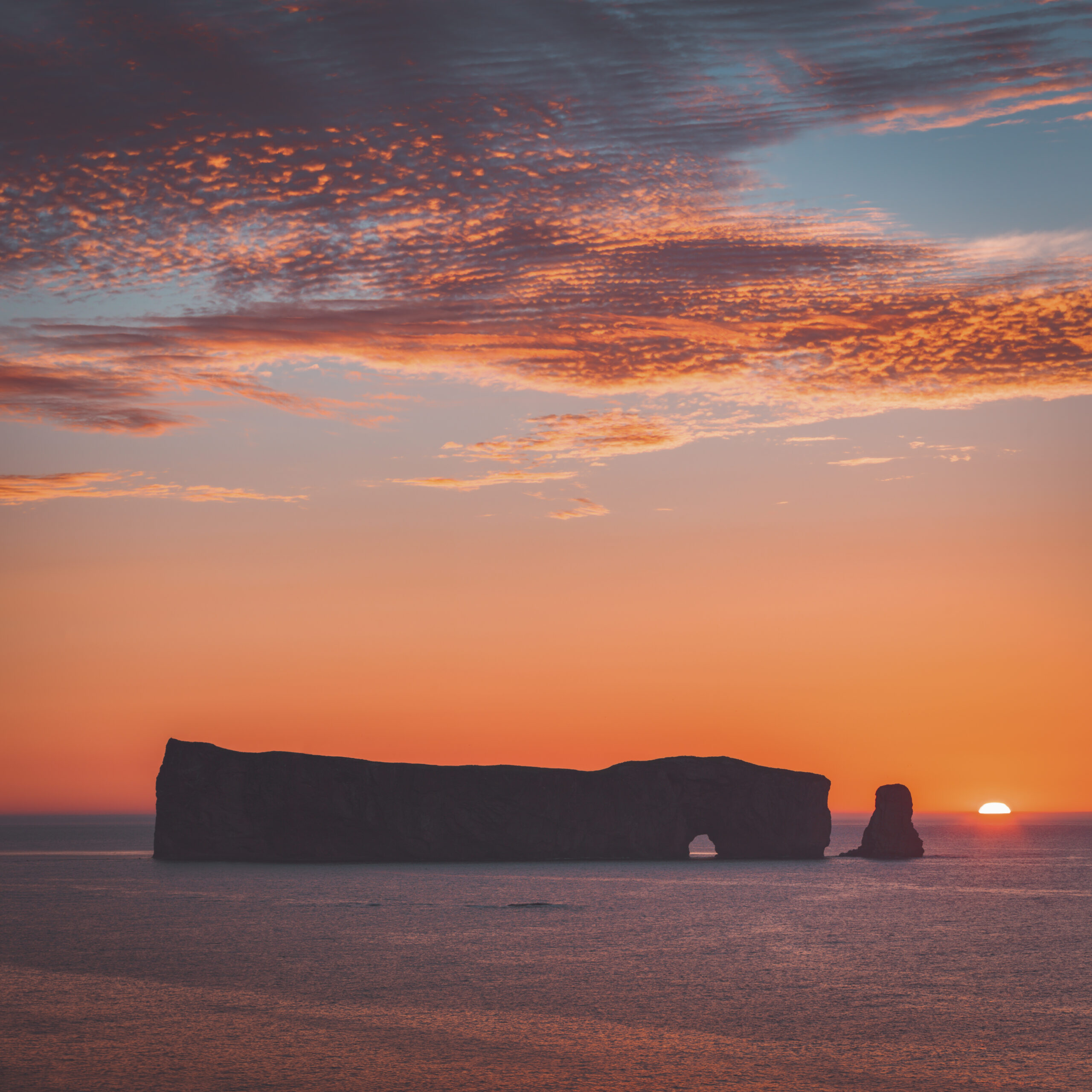 Rocher Perce, Gaspesie, Canada - The Rocher Percé is a huge sheer rock formation in the Gulf of Saint Lawrence on the tip of the Gaspé Peninsula in Quebec, Canada