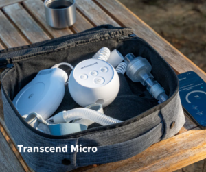 Transcend Micro travel CPAP machine packed in a compact carrying case with tubing and mask, designed for portable sleep apnea therapy.